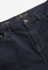 Next Traperice uskog kroja - dark blue denim
