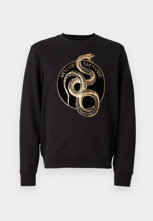 Black sweatshirt with a crew neckline featuring a gold snake graphic and "Armani Exchange" text inside a circular design on the front.
