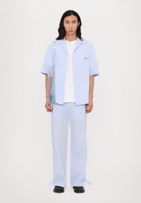 Fiorucci STRIPED LOGO TROUSERS UNISEX - Kelnės - light blue