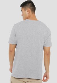 Gray short-sleeve t-shirt made from soft fabric, featuring a relaxed fit and a simple crew neckline without visible logos or patterns.