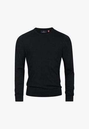 Maglione nero con scollo rotondo, maniche lunghe e polsini e orlo a coste. Tessuto strutturato con una leggera lucentezza. Etichetta sul collo.