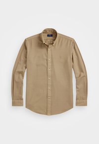 Camicia beige a maniche lunghe con colletto a punta, realizzata in tessuto morbido, con un piccolo logo ricamato sul petto.