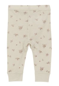 Lichtbeige leggings met een bloemenpatroon in gedempt roze en groen. Heeft een zachte textuur en een elastische taille. Gesloten bij de enkels.