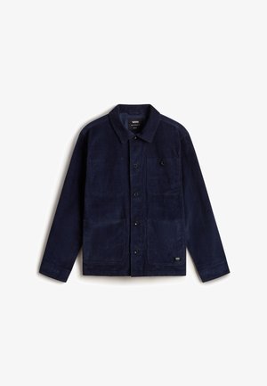 Veste en velours côtelé bleu marine avec un col, fermeture à boutons, deux grandes poches avant et un petit patch logo près de l'ourlet.