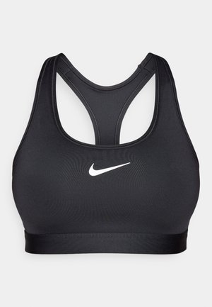 Fekete sportmelltartó versenyzős hátrész dizájnnal, sima anyagból készült. Elöl fehér Nike logó található, az alján széles, rugalmas szalaggal.