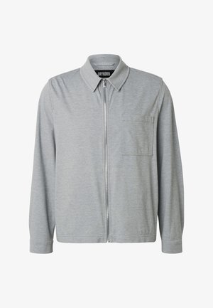 Camicia grigia chiaro a maniche lunghe con cerniera, colletto appuntito e taschino sul petto, realizzata in tessuto morbido da Drykorn.
