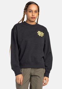 Black sweatshirt with a crew neck, ribbed cuffs, and hem; features a yellow spiral logo on the chest; cotton material with a smooth texture.