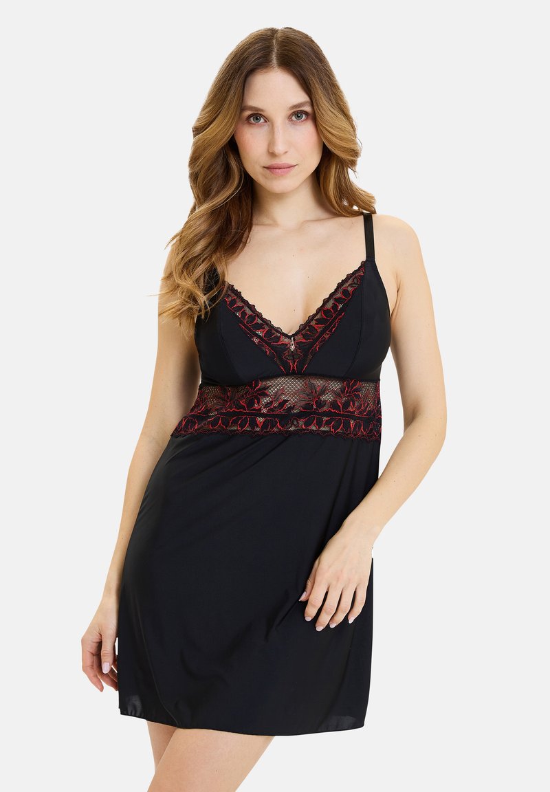 Nuisette noire avec un décolleté en V profond et des détails en dentelle rouge sur le corsage et l'ourlet. Tissu lisse avec des bretelles réglables.