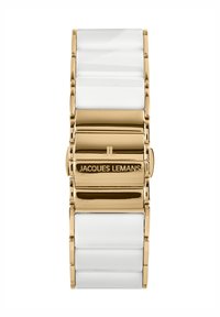 Reloj de tono dorado con una pulsera de cerámica blanca suave, que presenta segmentos enlazados y un cierre marcado con "JACQUES LEMANS."