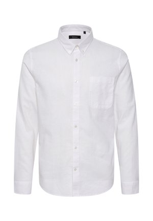 Camisa de algodón blanca de manga larga con cuello con botones, bolsillo delantero y tapeta de botones tradicional. Textura suave y ajuste a medida.