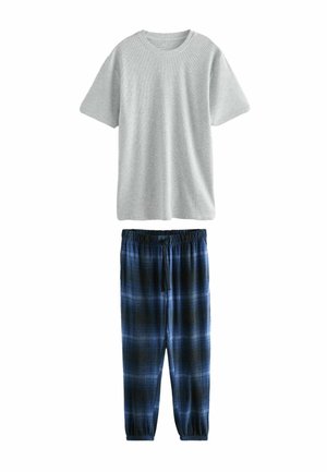 Gray short-sleeve T-shirt paired with blue plaid pajama pants featuring an elastic waistband and cuffed ankles for comfort.