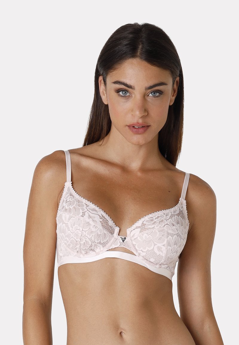 Bralette in pizzo rosa con motivo floreale, supporto con ferretto, bordi scallop e spalline regolabili. Chiusura con gancio metallico al centro frontale.