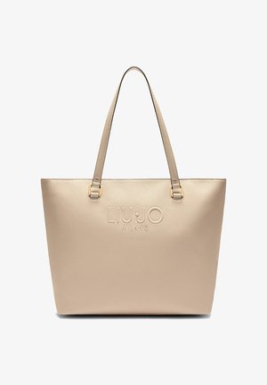 Sac fourre-tout en simili cuir beige avec le logo "LIU JO MILANO" en relief, deux poignées, et une surface texturée. Forme simple et rectangulaire.