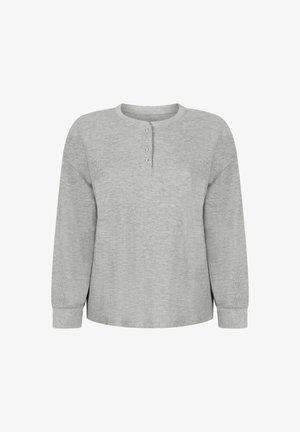 Lichtgrijs henley-shirt met lange mouwen. Geweven stof met een ronde hals en een knoopsluiting met vier knopen. Losse pasvorm, licht afgeronde zoom aan de onderkant.