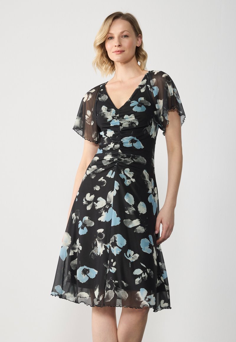 Floral midi dress in black, featuring blue and gray abstract patterns, short sheer flutter sleeves, and a fitted waist with gathering details.