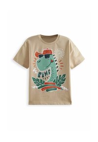 Beige bomulds T-shirt med et grønt dinosaur grafik iført solbriller, en rød kasket og teksten "RAWR," omgivet af grønne blade og cirkulære accenter.
