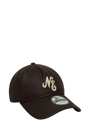 Brown cap with a curved visor, fabric texture, features embroidered "NE" logo in cream color, and an adjustable strap at the back.