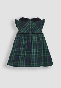 Vestido a cuadros verde y marino con mangas con volantes, cuello con solapa y parte delantera abotonada. La tela presenta un acabado texturizado.
