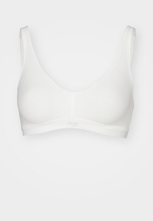Hvid trådløs bh med en glat overflade, brede stropper og et enkelt design. Har et mærke bånd i bunden. Blød, strækbar stof.