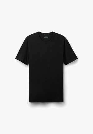 T-shirt nera a maniche corte con scollo tondo, mostrata distesa su sfondo bianco con etichetta visibile sul collo.