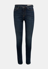 Jean skinny bleu foncé avec poches avant, passants pour ceinture et fermeture à bouton, présenté sur un fond clair uni.