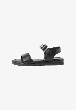Black leather sandal featuring two wide straps, a buckle accent, and a flat sole with a textured finish for grip. Simple, contemporary design.