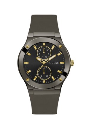 Orologio da polso Guess nero e oro con cinturino in metallo, tre lancette dorate, indici delle ore dorati e due sub-quadranti per i giorni e l'ora a 24 ore.