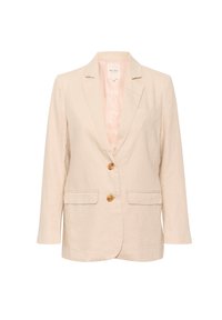 Vaalea pellavapuku, jossa on kauluskäänteet, kaksi etutaskua ja kaksi puusta valmistettua nappia. Pehmeä, teksturoitu kangas ja rento istuvuus.