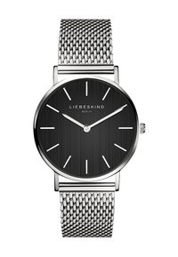 Runde silberne Metallarmbanduhr mit einem schwarzen strukturierten Zifferblatt, minimalistischen Stundenmarkierungen und einem silbernen Mesh-Armband. Markenname über dem Zifferblatt sichtbar.