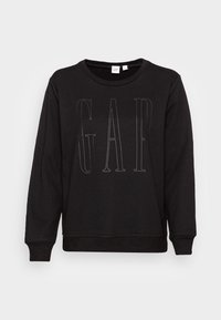 Svart sweatshirt i bomull, med rund hals, långa ärmar och en diskret, präglad "GAP"-logotyp fram.