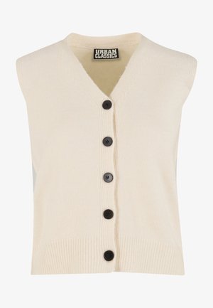 Beige mouwloos vest gemaakt van zachte gebreide stof, met een V-hals, zwarte knopen aan de voorkant en geribbelde afwerking langs de zoom.