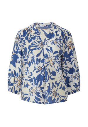 Bloes met bloemenmotief, bestaande uit een witte basis met blauwe en oranje bloemen, V-hals en driekwart pofmouwen. Lichtgewicht stoftextuur.