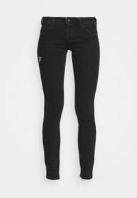 Kapeat mustat farkut, jotka on valmistettu denimistä ja joissa on sileä rakenne. Farkuissa on etutaskut, vetoketjukiinnitys ja pieni graafinen yksityiskohta lahkeessa.