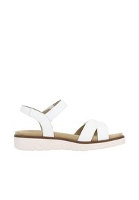 Sandale en cuir blanc avec une bride de cheville ajustable, design croisé à l'avant et semelle intérieure rembourrée. Présente une semelle épaisse et texturée.