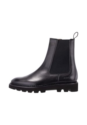 Bottine Chelsea en cuir noir avec panneaux élastiques sur les côtés, languette de traction au talon et semelle épaisse rainurée.