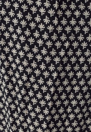 Fabric with a black background featuring a repeated pattern of light cream-colored leaf shapes, smooth texture, densely packed design.