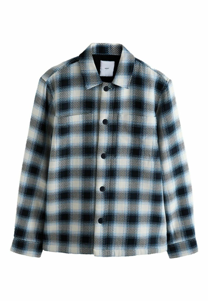 Prešívaná flanelová bunda s veľkým čiernobielo-modrým kockovým vzorom, zapínaním na gombíky, rozloženým golierom a dlhými rukávmi.
