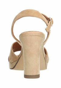 Beige nubuck sleehakken met een achterband en een enkelgesp. Beschikt over een chunky hak en een ronde, open teenontwerp.