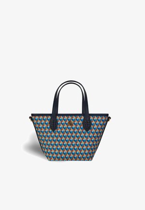 Small tote bag with geometric blue, orange, and tan cube pattern, dark navy handles, and a round gold emblem on the front.