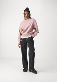 Carhartt WIP AMERICAN SCRIPT - Mikina - glassy pink