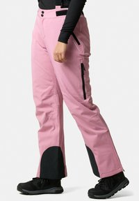 Pink snow pants with adjustable straps, zippered pockets, and black accents at the cuffs. Made of durable material for outdoor use.