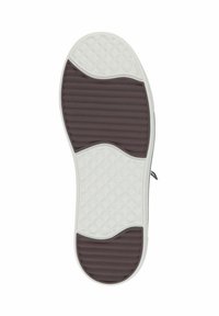Shoe sole with a brown rubber bottom featuring horizontal ridges and white textured edges, designed for traction and flexibility.