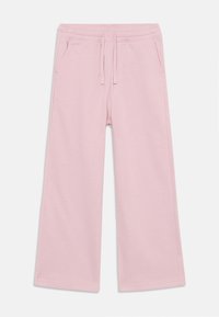 Light pink wide-leg sweatpants with an elastic waistband and drawstring, featuring two side pockets and a soft, textured fabric.