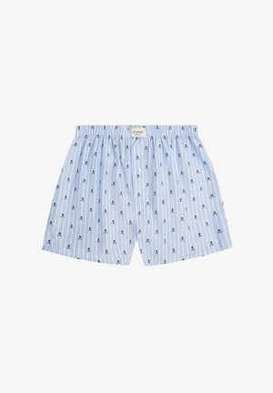 Lichtblauwe katoenen boxers met verticale witte strepen, voorzien van kleine marineblauwe schedelpatronen en een knoopsluiting aan de voorkant. Inclusief elastische tailleband.