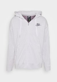 Světle šedá mikina Nike na zip s kapucí na šňůrku, předními kapsami a malým černým logem Nike na levé hrudi.