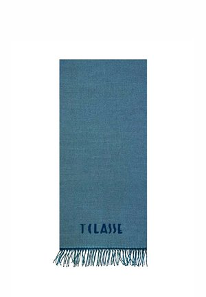 Coperta intrecciata blu con bordi frangiati. Presenta una texture sottile e un logo stampato "T CLASSE" nella parte inferiore.