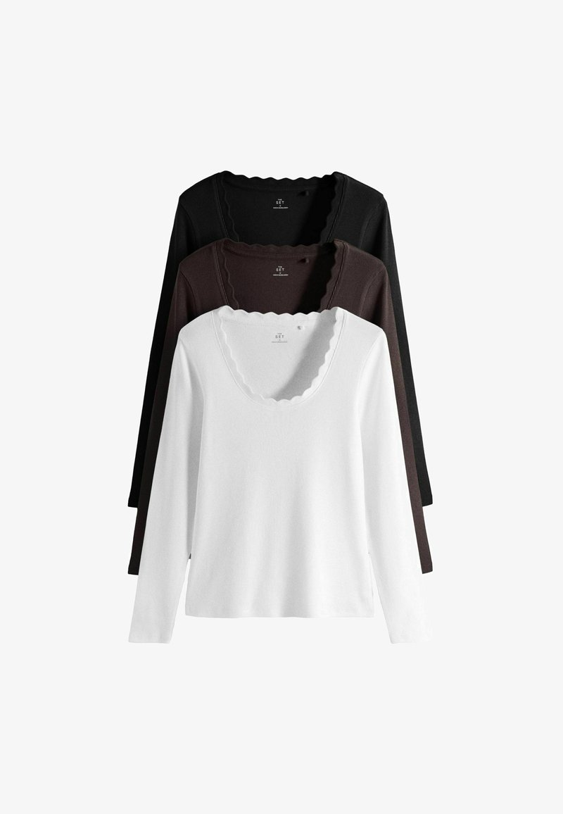 Three long-sleeve tops with scalloped scoop necklines in white, dark brown, and black, arranged stacked with white in front.