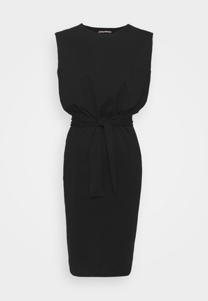 Sleeveless black knee-length dress with a cinched waist and fabric belt tied at the front, displayed on a plain light background.