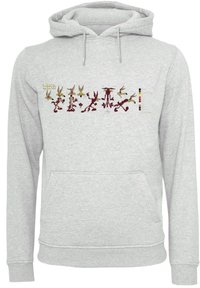 Grå hettegenser med kengurulomme, med et trykt design av Wile E. Coyote og Road Runner-karakterene over brystet, sammen med en fargeguide.