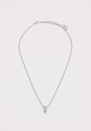Silver necklace with a twisted chain. Features a pendant with a crystal accent and a rounded bottom. Adjustable length with clasp closure.